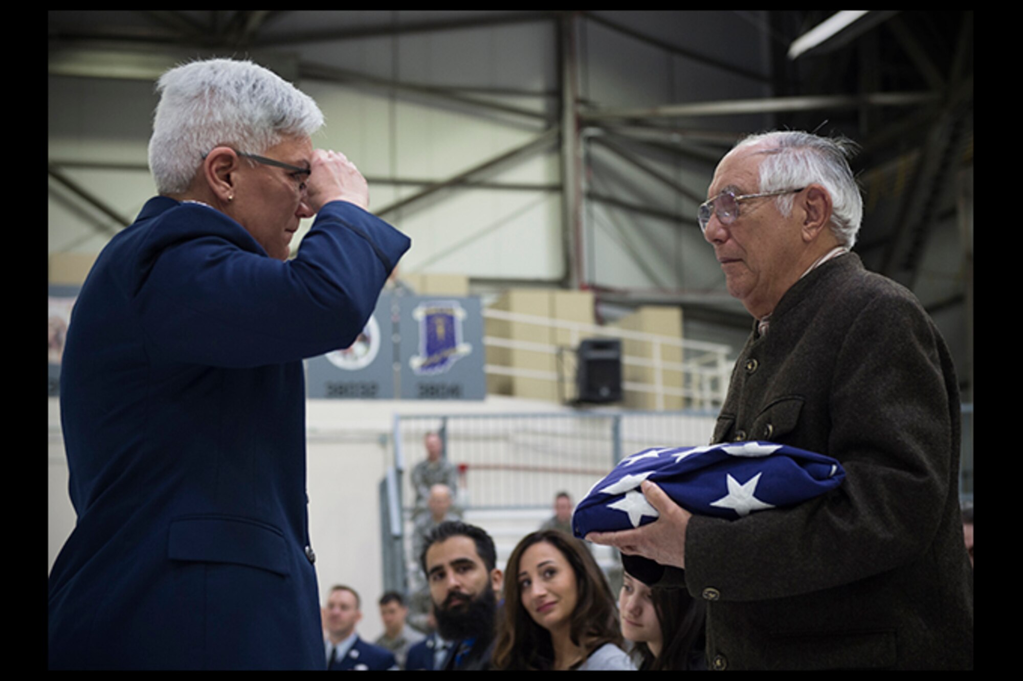 Col. Anna Schulte, 434th Maintenance Group commander, gives an emotional salute after handing off her own retirement flag to her father, retired Chief Master Sgt. Alfonso DeJesus, during her retirement ceremony at Grissom Air Reserve Base, Ind., April 1, 2017. Between Schulte and her father, a career maintainer, they have over 60 years in the Air Force. (U.S. Air Force photo/Staff Sgt. Katrina Heikkinen) 