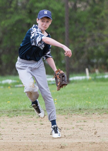 Hanscom Middle School's Matthew Nees makes a throw across the field to record an out during a baseball game against Lincoln Midde School on base May 9. Lincoln won the game 5 to 1. (U.S. Air Force photo by Walter Santos)