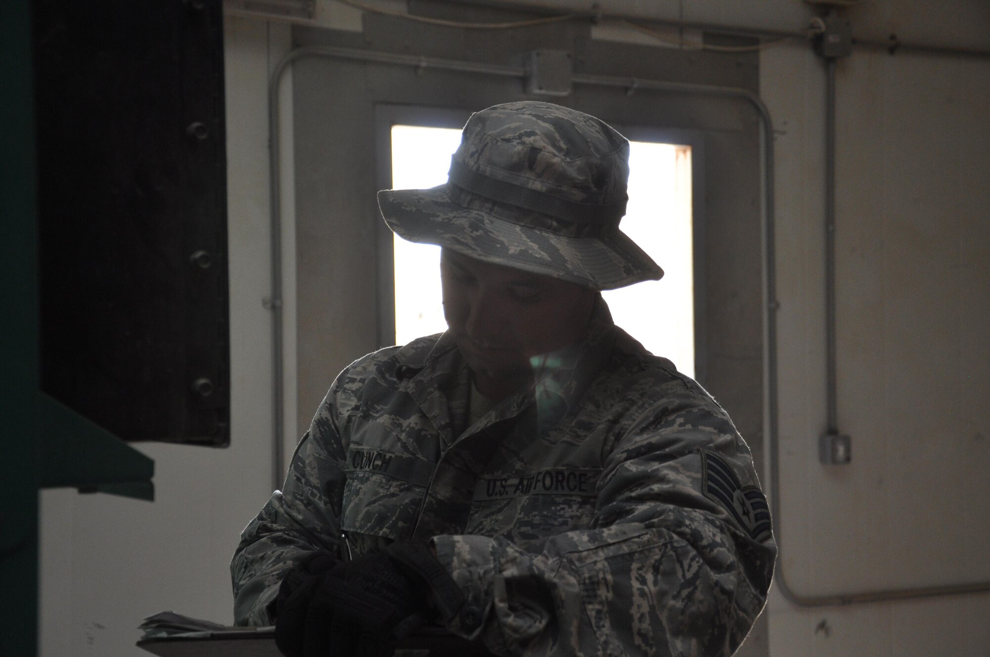 Staff Sgt. Jason D. Clinch, a generator maintenance program manager with the 386th Expeditionary Civil Engineer Squadron, writes down instrument data from a power generator during a preventative maintenance check Wednesday May 10, 2017, at an undisclosed location in Southwest Asia.  The power generator serves as a supplement to the host nation electrical grid. Staff Sergeant Clinch is deployed from the 30th Space Wing, Vandenberg Air Force Base, Calif.