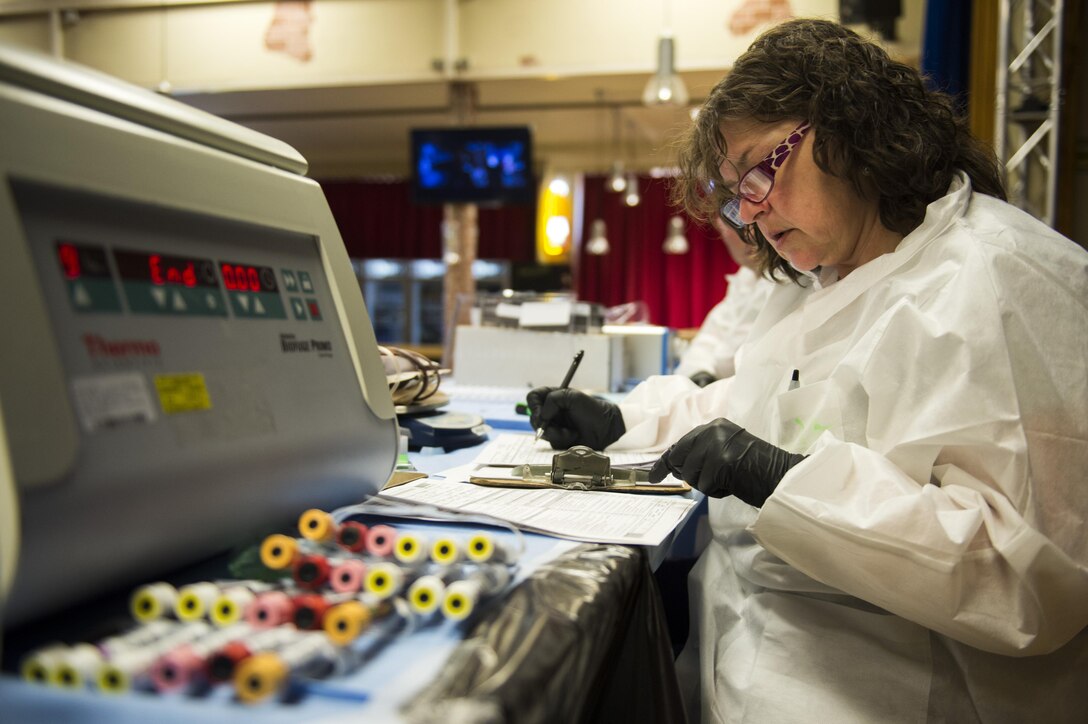 Pamela Hudson, Armed Services Blood Program Europe phlebotomist, processes donor’s blood during a blood drive in the Brick House at Spangdahlem Air Base, Germany, May 10, 2017. A scheduled blood drive takes place at Spangdahlem Air Base approximately every 56 days, allowing a constant replenished stock of blood for patients in need.