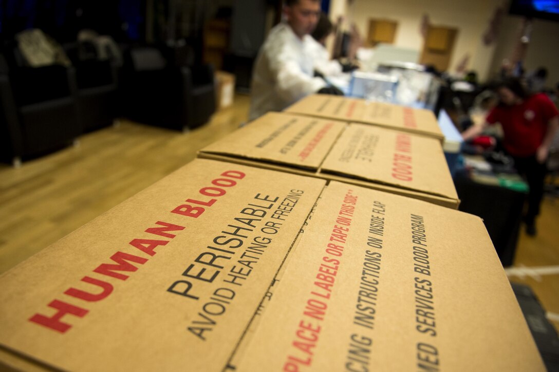 Stacked boxes, labeled “Human Blood,” sit next to the blood processing station during an Armed Services Blood Program blood drive in the Brick House at Spangdahlem Air Base, Germany, May 10, 2017. Since the ASBP’s inception more than 60 years ago, more than 1.5 million units of blood have been provided to treat battlefield illnesses and injuries.