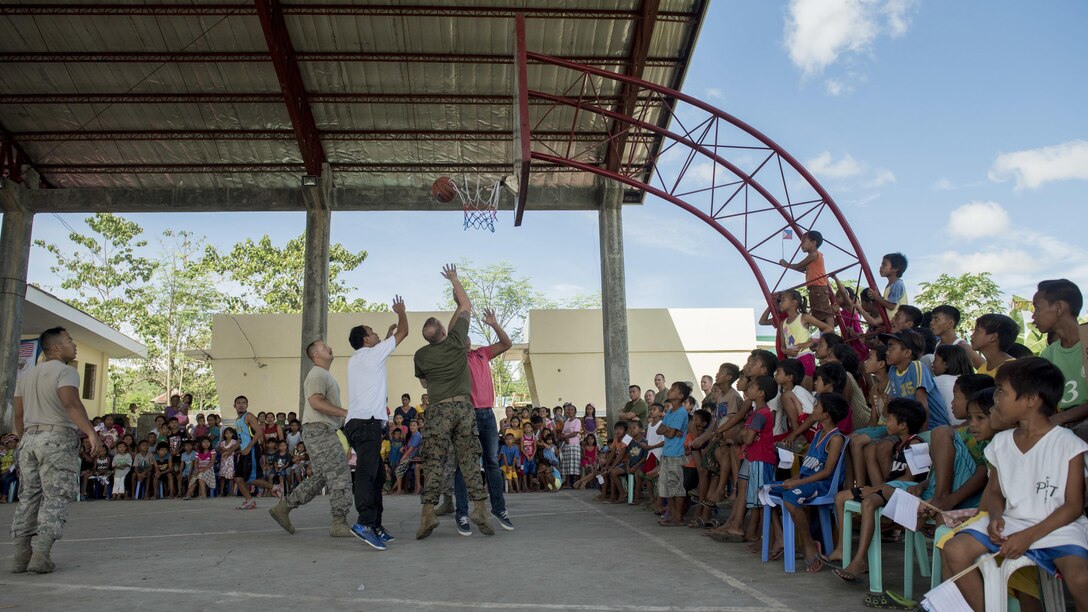 U.S. service members and local community members play basketball at Margen Elementary School in Ormoc, Leyte, May 2, 2017, as part of building camaraderie during Balikatan 2017. Balikatan is an annual U.S.-Philippine bilateral military exercise focused on a variety of missions, including humanitarian assistance and disaster relief, counterterrorism, and other combined military operations. 