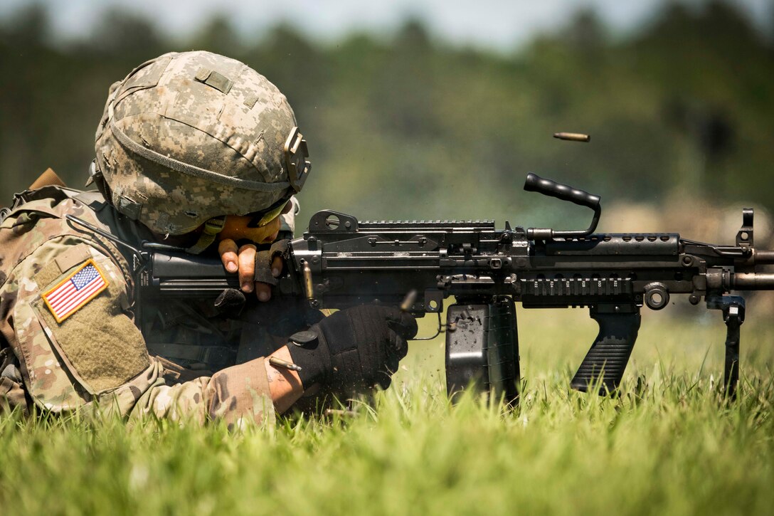 A South Carolina Army National Guardsman fires a machine gun during the South Carolina National Guard Air and Ground Expo at McEntire Joint National Guard Base, S.C., May 6, 2017. The soldier is assigned to the 4th Battalion, 118Th Combined Arms Battalion, 218th Maneuver Enhancement Brigade. Army National Guard photo by Sgt. Brian Calhoun