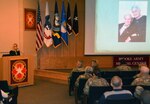 Varda Ratner speaks during the Brooke Army Medical Center Days of Remembrance Observance April 25 about her parents, Nathan and Ilona Haendel, who survived the Holocaust. 