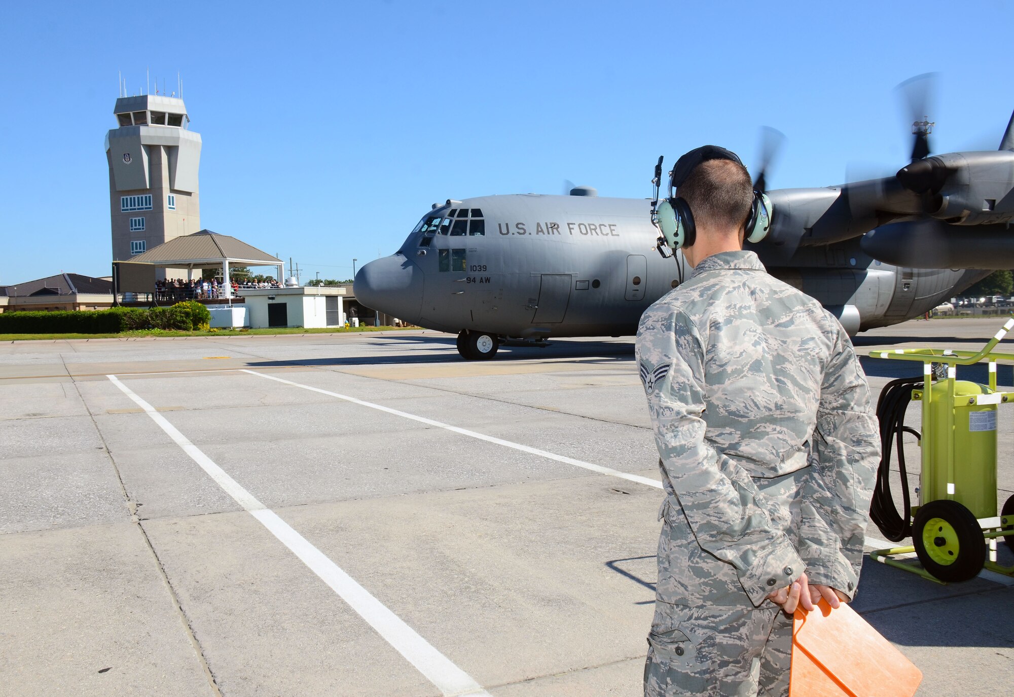 Families, friends and community leaders look on as four C-130 H3 Hercules aircraft depart Dobbins Air Reserve Base, Georgia May 8, 2017 in route to Southwest Asia. Over 150 aircrew, aircraft maintenance and support personnel from the 94th Operations and Maintenance Groups will complete a four-month Air Expeditionary Force rotation, during which they will be responsible for cargo and personnel airlift and tactical airdrop missions. (U.S. Air Force photo/Don Peek)