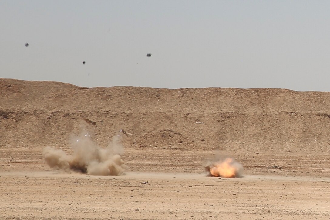 A pair of C-4 blocks explode during a demolition range at Camp Shorabak, Afghanistan, May 10, 2017. Marines and Sailors assigned to Task Force Southwest partnered with Afghan National Army soldiers from the 215th Corps as part of an explosive hazard reduction training course. The training provides the soldiers with the knowledge and skills needed to overcome the threats of improvised explosive devices.  (U.S. Marine Corps photo by Sgt. Lucas Hopkins)