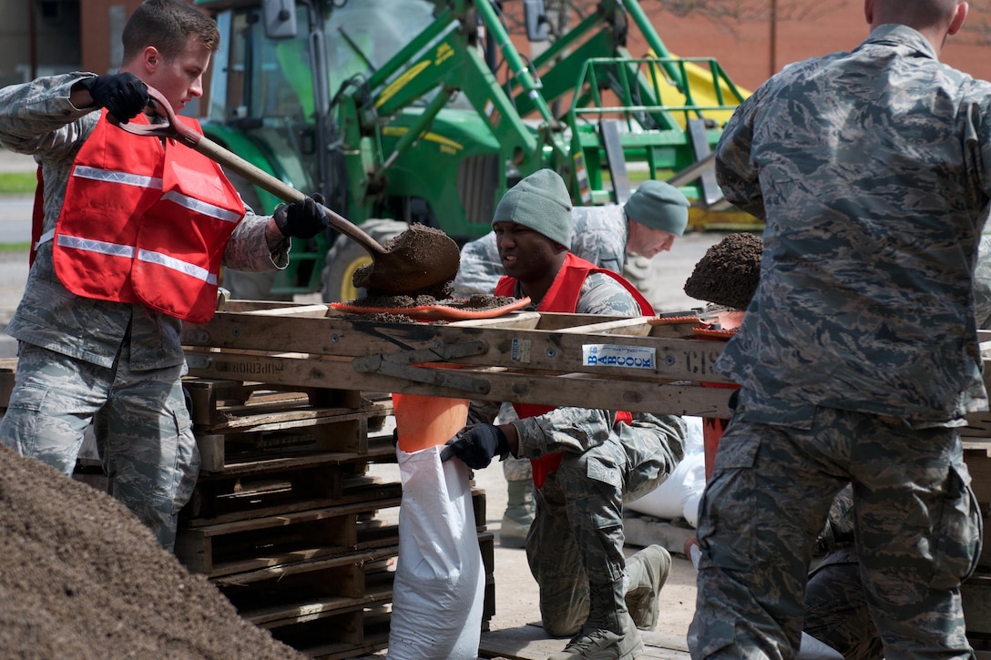 New York Air National Guardsmen assigned to the 174th Attack Wing prepare sandbags in Williamson, N.Y., to combat flooding, May 9, 2017. The airmen filled more than 6,000 sandbags for Williamson. New York Air National Guard photo by Master Sgt. Lillque Ford 