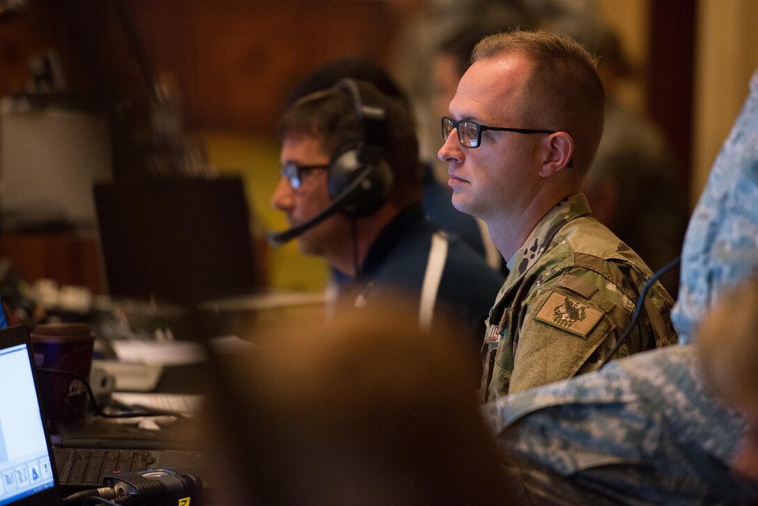 Senior Airman Zachary Hart, 137th Special Operations Wing information technology network specialist, prepares a video teleconference during the 2017 Air National Guard Leadership Conference at the National Center for Employee Development Conference Center, Norman, Okla., May 8, 2017. The leadership conference, attended by general officers, adjutant generals, wing commanders, command chiefs and directors of staff from across the 54 U.S. states and territories, focused on leading, protecting and supporting the 21st-century Guard Airman. (U.S. Air National Guard photo by Senior Master Sgt. Andrew M. LaMoreaux)