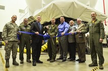 A ribbon is cut to signify the opening of a KC-135 flight simulator at the 171st Air Refueling Wing near Pittsburgh Pa. May 5, 2017. Holding the ribbon from left to right is Maj. Jeremy Ketter, Commander of the 171 Civil Engineer Squadron, Brig. Gen. Tony Carrelli, Pennsylvania Adjutant General, Congressman Tim Murphy, representing the 18th district of Pennsylvania, Col. Gregg Perez, 171st Wing Commander, Tim Bush, KC-135 Aviation Training System Operations and Maintenance Program Manager for CAE, Cliff Sanchez, KC-135 Aviation Training System Manager at Air Mobility Command, Rep. Mark Mustio, 44th Legislative District, western Allegheny, and Lt. Colonel, Jim Swanik, Operations Support Commander. (U.S. Air National Guard photo by Staff Sgt. Manners)