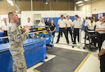 Staff Sgt. Kenan Torrance, 433rd Aircraft Maintenance Squadron sheet metal technician, speaks to members of the Department of Defense Executive Leadership Development Program  May 10, 2017 at Joint Base San Antonio-Lackland, Texas.  (U.S. Air Force photo by Benjamin Faske)

