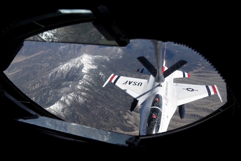 A KC-135 Stratotanker assigned to McConnell Air Force Base, Kan. refuels an F-16 Fighting Falcon May 10, 2017, over Colorado. The F-16 crew members are part of the U.S. Air Force Thunderbirds, the Air Force’s air demonstration team, and were traveling to an airshow in Pittsburgh, Pa. (U.S. Air Force photo/Airman 1st Class Erin McClellan)
