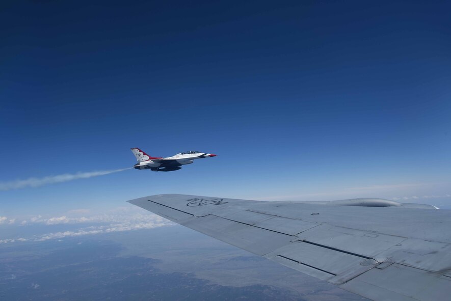 An F-16 Fighting Falcon assigned to Nellis Air Force Base, Nev., flies near the wing of a KC-135 Stratotanker assigned to McConnell Air Force Base, Kan., May 10, 2017. The jet traveled alongside the KC-135 from Colorado to Kansas during its journey to Pennsylvania, where it is scheduled to perform in an airshow. (U.S. Air Force photo/Airman 1st Class Erin McClellan)