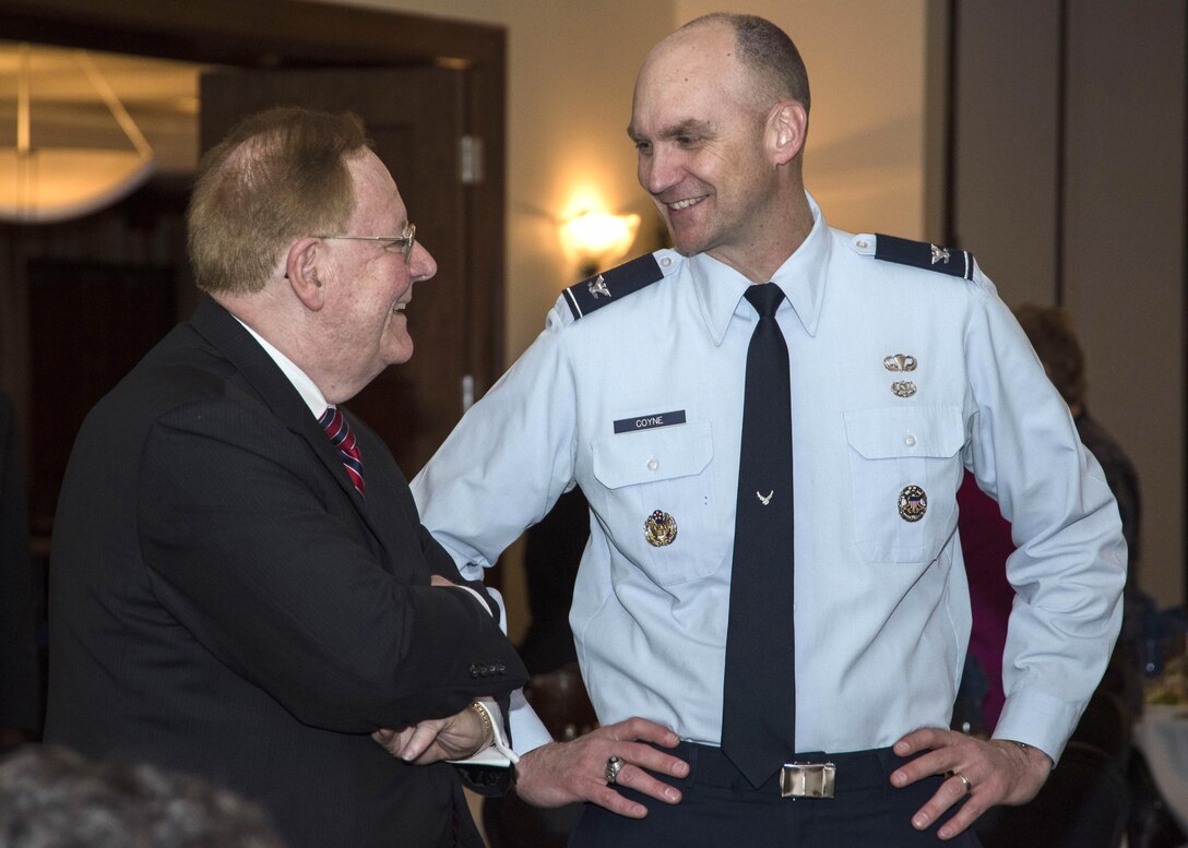 C. Philip Nichols Jr., left, Prince George’s County Circuit Court chief judge and honorary commander, speaks with Col. Erik Coyne, right, 11th Wing staff judge advocate commander, during the honorary commander ceremony at Joint Base Andrews, Md., May 5, 2017. The ceremony inducted, recognized and retired individuals from the JBA Honorary Commander Program, which began in 1999 and matches a community leader with a military leader to provide commanders a means to educate participants about the armed forces and their various missions. (U.S. Air Force photo by Senior Airman Jordyn Fetter)