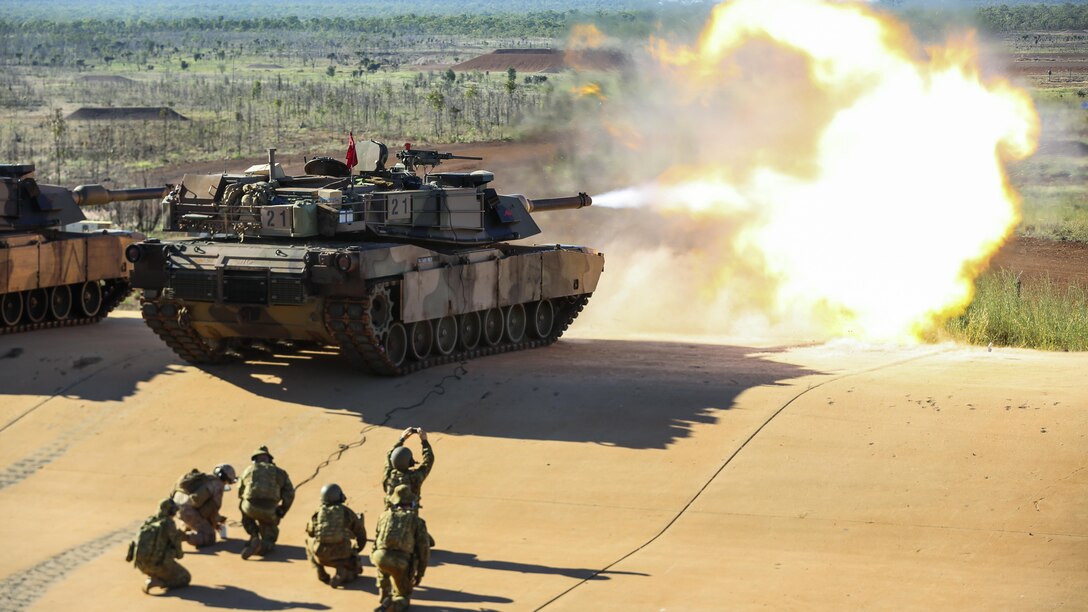 Marine Corps Lance Cpl. Fernando Griego remotely fires an Australian Army M1A1 Abrams tank at the Mount Bundey Training Area near Darwin, Australia, May 6, 2017. Marines remotely test fired the Abrams as a precaution after Australian soldiers replaced the barrel. Marine Corps photo by Lance Cpl. Damion Hatch Jr.