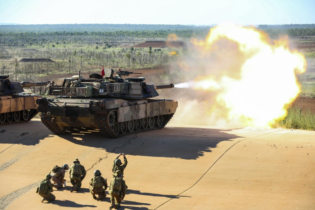 Marine Corps Lance Cpl. Fernando Griego remotely fires an Australian Army M1A1 Abrams tank at the Mount Bundey Training Area near Darwin, Australia, May 6, 2017. Marines remotely test fired the Abrams as a precaution after Australian soldiers replaced the barrel. Marine Corps photo by Lance Cpl. Damion Hatch Jr.