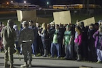 National Guard members take part in a crowd control exercise for Exercise Guardian Response 17 at the Jennings County Fairgrounds May 7, 2017. Simulated riots were staged in order to prepare first responder groups to react to the immediate  consequences of a major crisis.