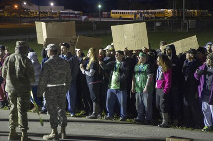 National Guard members take part in a crowd control exercise for Exercise Guardian Response 17 at the Jennings County Fairgrounds May 7, 2017. Simulated riots were staged in order to prepare first responder groups to react to the immediate  consequences of a major crisis.