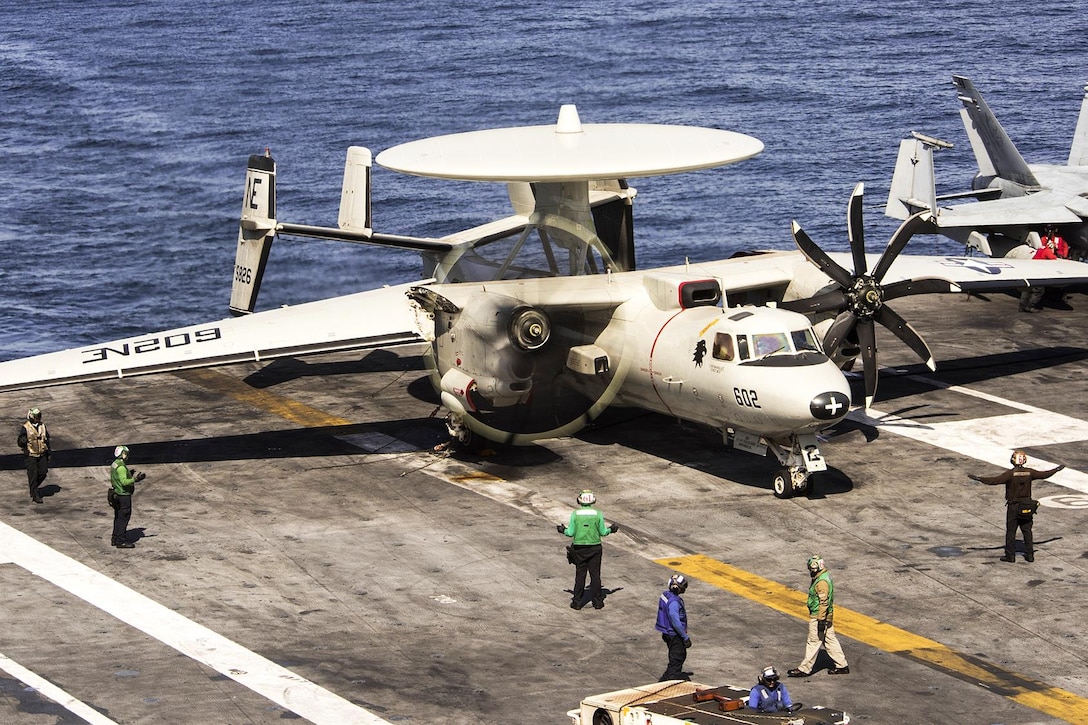 Sailors ready a Navy E-2C Hawkeye for takeoff on the flight deck of the aircraft carrier USS Carl Vinson in the Western Pacific Ocean, May 2, 2017. Navy photo by Petty Officer 3rd Class Matthew Granito