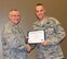 Col. Jonathan M. Philebaum, commander of the Illinois-based reserve 932nd Airlift Wing, congratulates the newest Community College of the Air Force graduate, Staff Sgt. Scott Vermeer during a special ceremony held May 7, 2017, at Scott Air Force Base, Illinois   (U.S. Air Force photo by Lt. Col. Stan Paregien)