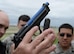Greg Wooten, the police officer and law enforcement instructor for the 28th Security Forces Squadron, explains the reloading event during a training exercise in at Ellsworth Air Force Base, S.D., May 9, 2017. Airmen simulated an injured support arm, and were required to reload only with their primary firing hand. (U.S. Air Force photo by Airman Nicolas Z. Erwin)
