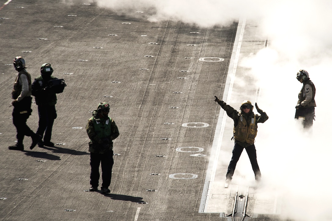 Sailors conduct flight operations on the flight deck of the aircraft carrier USS Carl Vinson in the Western Pacific Ocean, May 2, 2017. Navy photo by Petty Officer 3rd Class Matthew Granito