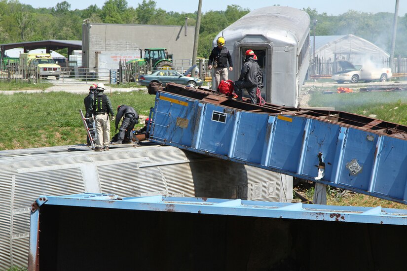 U.S. Army Reserve firefighters with the 468th Engineer Detachment, Danvers, Massachusetts, assess the situation at a train derailment exercise, part of Guardian Response 17 at Muscatatuck Urban Training Center, Butlerville, Indiana, May 7, 2017.
Nearly 4,100 Soldiers from across the country are participating in Guardian Response 17, a multi-component training exercise to validate U.S. Army units’ ability to support the Defense Support of Civil Authorities (DSCA) in the event of a Chemical, Biological, Radiological, and Nuclear (CBRN) catastrophe.