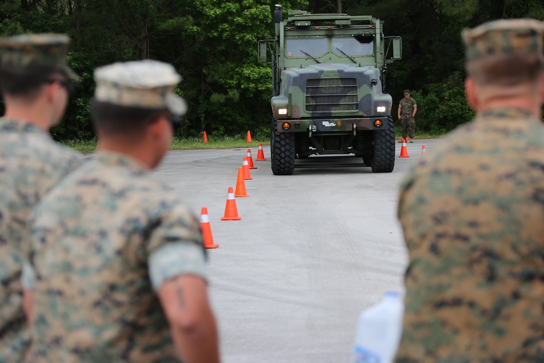 Marine transport operators observe a fellow student operating a M970 semitrailer refueler truck during a Semi-trailer Refueler Operator Course at Marine Corps Air Station Cherry Point, N.C., May 9, 2017. The course was filled with a combination of Marines assigned to 2nd Marine Aircraft Wing and various other units throughout II Marine Expeditionary Force.  Upon completion of the course, motor transport Marines gain the secondary military occupational specialty of semitrailer refueler operator. (U.S. Marine Corps photo by Cpl. Jason Jimenez/ Released)