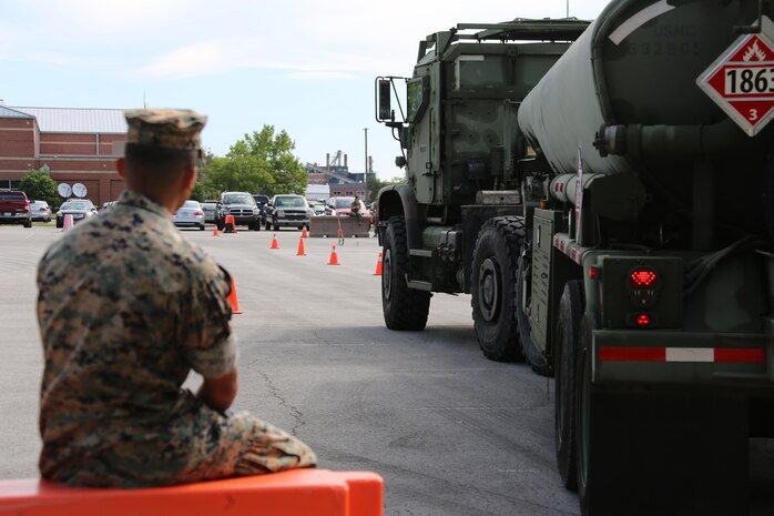 Cpl. Austin Pastor observes a student operating a M970 semitrailer refueler truck during a Semitrailer Refueler Operator Course held at Marine Corps Air Station Cherry Point, N.C., May 9, 2017. Upon completion of the month-long course, motor transport Marines gain the secondary military occupational specialty of semitrailer refueler operator. Pastor is a mobile refueler assigned to Marine Wing Support Squadron 272, Marine Aircraft Group 26, 2nd Marine Aircraft Wing. (U.S. Marine Corps photo by Cpl. Jason Jimenez/ Released)