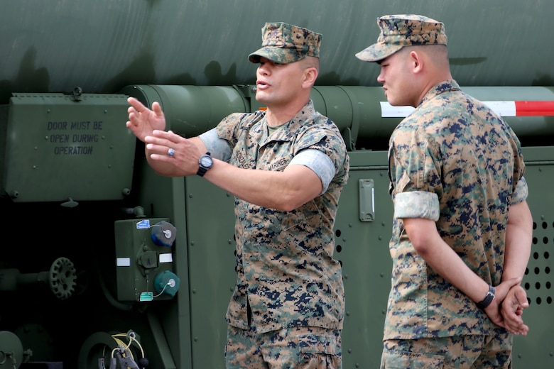 Staff Sgt. Edgar Gonzalez, left, gives instruction to Pfc. Chase Rodgers during a Semitrailer Refueler Operator Course at Marine Corps Air Station Cherry Point, N.C., May 9, 2017. The team of instructors traveled from U.S. Army Fort Leonard Wood, Mo., to train Marines assigned to East Coast commands on the skills needed to become a semitrailer refueler operator. Gonzalez is an SROC instructor assigned to the Marine Corps Detachment Training Command and Rodgers is a motor transport operator with 2nd Transport Battalion, Combat Logistics Regiment 2, 2nd Marine Logistics Group. (U.S. Marine Corps photo by Cpl. Jason Jimenez/ Released)