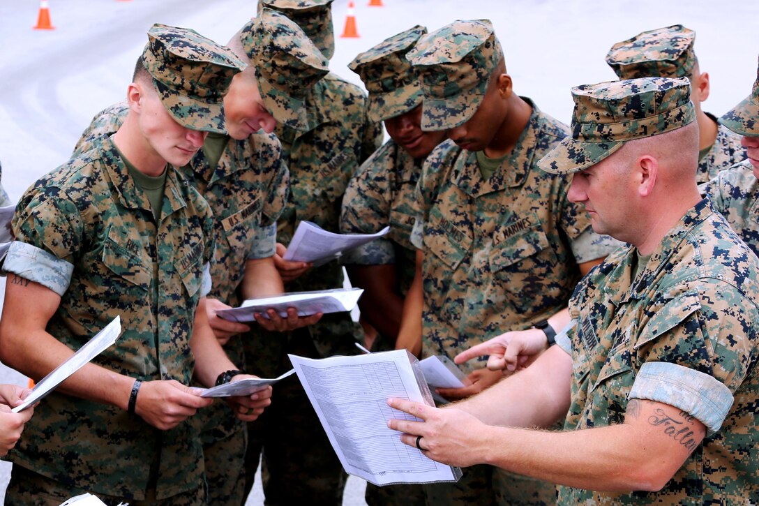Staff Sgt. Cory Wilbur, right, discusses course material with students during a Semitrailer Refueler Operator Course at Marine Corps Air Station Cherry Point, N.C., May 9, 2017. The course was filled with a combination of Marines assigned to 2nd Marine Aircraft Wing and various other units throughout II Marine Expeditionary Force. Upon completion of the course, motor transport Marines gain the secondary military occupational specialty, semitrailer refueler operator. Wilbur is a SROC instructor assigned to the Marine Corps Detachment Training Command, based out of U.S. Army Fort Leonard Wood, Mo. (U.S. Marine Corps photo by Cpl. Jason Jimenez/ Released)