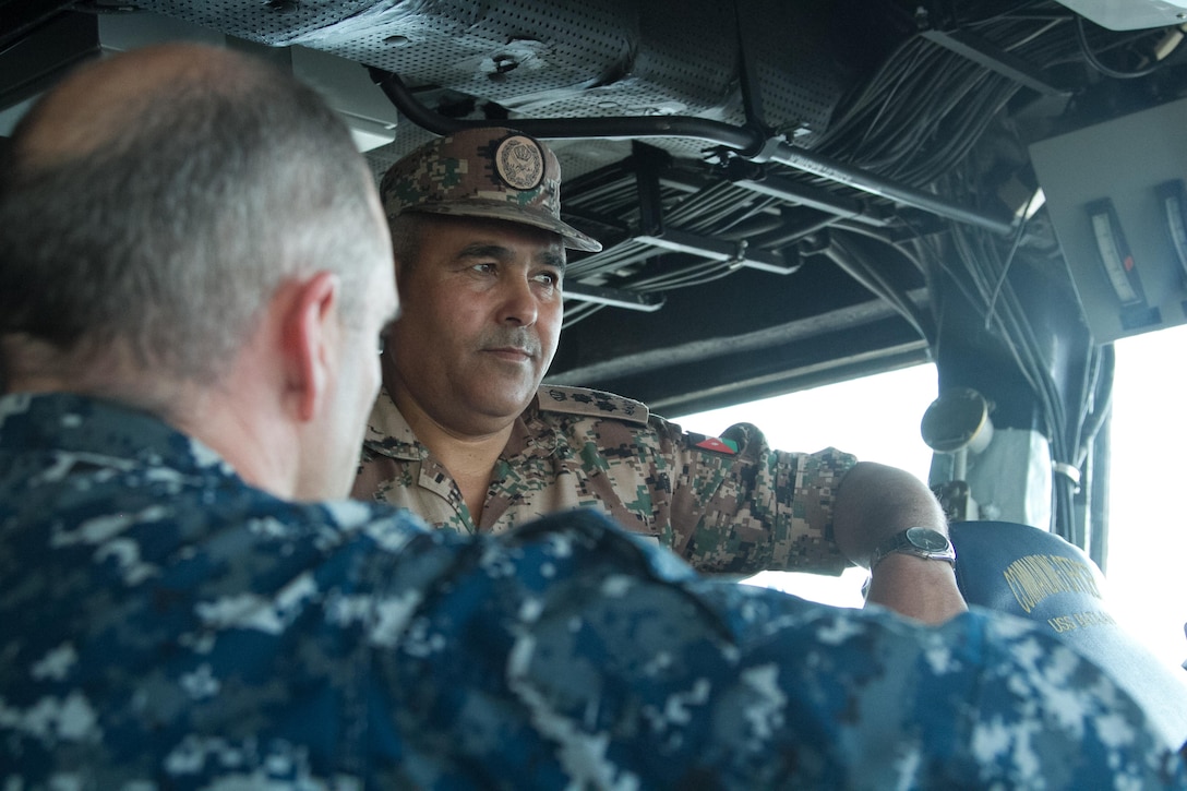 Jordanian Brig. Gen. Khalid al-Shara receives a briefing aboard the USS Bataan Navy Assault Ship.  Eager Lion is an annual U.S. Central Command exercise in Jordan designed to strengthen military-to-military relationships between the U.S., Jordan and other international partners. This year's iteration is comprised of about 7,200 military personnel from more than 20 nations that will respond to scenarios involving border security, command and control, cyber defense and battlespace management.  (U.S. Army photo by Sgt. Mickey A. Miller)
