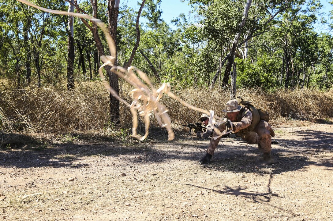 Marine Corps Lance Cpl. Eric Herrera works to clear a safe lane for his squad during training at the Mount Bundey Training Area near Darwin, Australia, May 6, 2017, to prepare for Exercise Predator Run. The exercise tests Marines’ combat efficiency and increase performance on a small-unit level. Marine Corps photo by Lance Cpl Damion Hatch Jr.