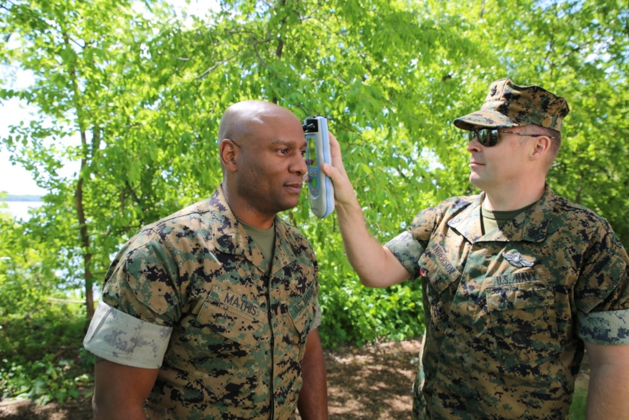 Navy Chief Petty Officer Jared Anderson, a hospital corpsman, uses an Infrascanner to assess Marine Corps Master Gunnery Sgt. Maceo Mathis for intracranial hematomas -- bleeding within the skull -- at Marine Corps Base Quantico, Va., May 8, 2017. The scanner is a portable, medical diagnostic device that provides early detection of intracranial hematomas in the field, potentially saving lives and improving casualty care and recovery. Infrascanners are available for medical personnel for use at battalion aid stations across the Marine Corps. Marine Corps photo by Ashley Calingo