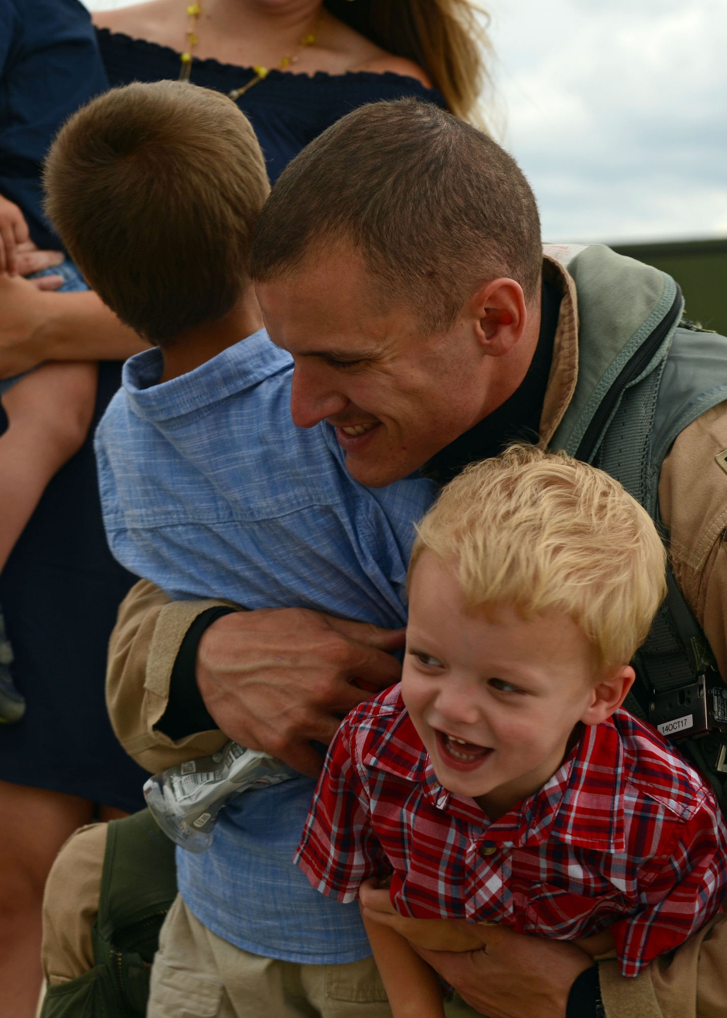 A U.S. Airman assigned to the 79th Fighter Squadron (FS) hugs his children after returning to Shaw Air Force Base, S.C., May 4, 2017. After arriving home from their six-month deployment, 79th FS Airmen began the processes of reconnecting with their families and day-to-day life of being stateside. (U.S. Air Force photo by Airman 1st Class Kathryn R.C. Reaves)