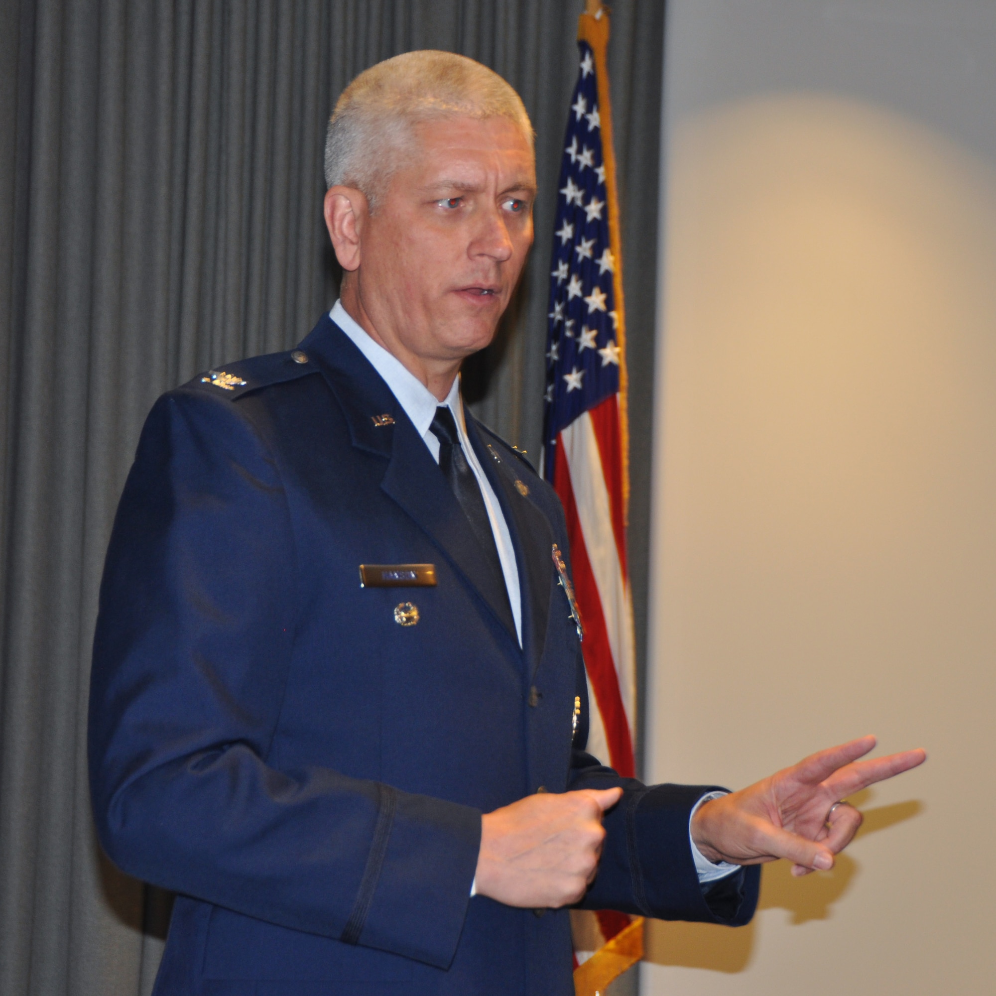 Col. David Hanson, 919th Special Operations Wing vice commander, makes remarks as featured speaker for the University of West Florida's Air Force ROTC Detachment 014 commencement and commissioning ceremony May 5, 2017 at Hurlburt Field, Fla.  Hanson, who likewise was  commissioned through the AFROTC, implored the new second lieutenants to find success by living the Air Force core values, maintaining balance in their lives and actively building on their leadership foundation. (U.S. Air Force photo/Dan Neely)