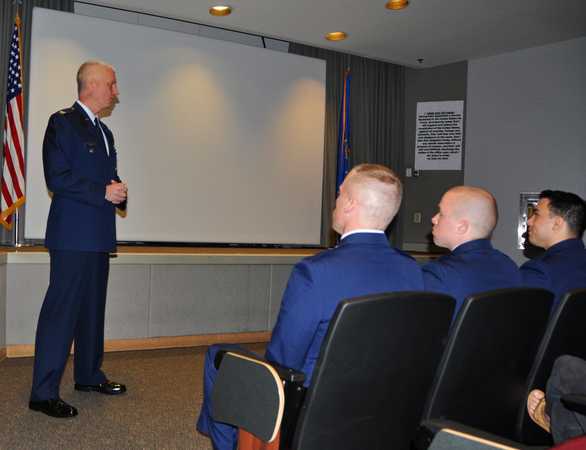 Col. David Hanson, 919th Special Operations Wing vice commander, makes remarks as featured speaker for the University of West Florida's Air Force ROTC Detachment 014 commencement and commissioning ceremony May 5, 2017 at Hurlburt Field, Fla.  Hanson, who likewise was  commissioned through the AFROTC, implored the new second lieutenants to find success by living the Air Force core values, maintaining balance in their lives and actively building on their leadership foundation. (U.S. Air Force photo/Dan Neely)