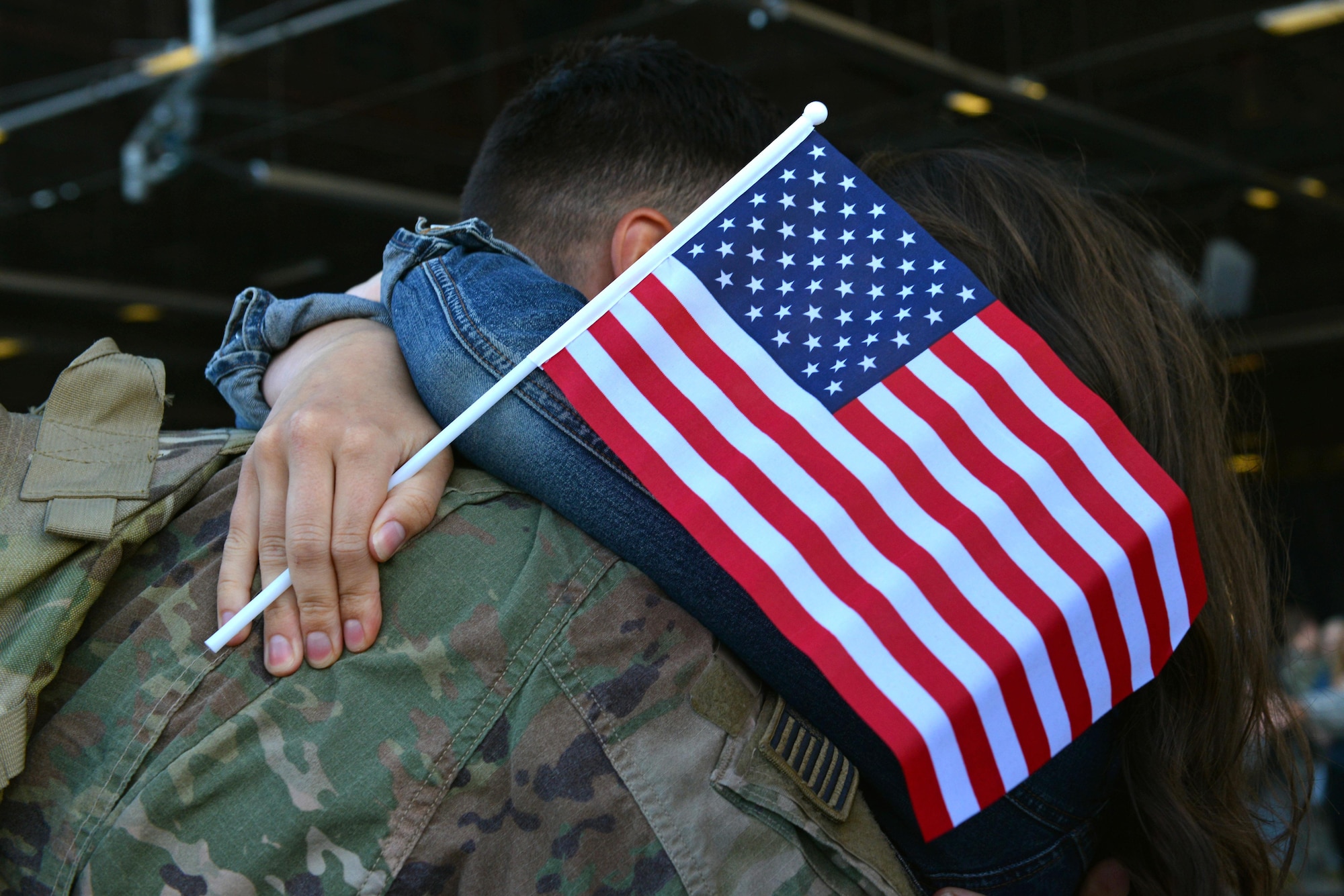 A U.S. Airman assigned to the 20th Fighter Wing embraces his spouse after returning to Shaw Air Force Base, S.C., May 5, 2017. The 79th Fighter Squadron and 20th Aircraft Maintenance Squadron Airmen were required to attend a reintegration briefing aimed at smoothing their transition home after a six-month deployment to the U.S. Central Command area of responsibility. (U.S. Air Force photo by Airman 1st Class Destinee Sweeney)