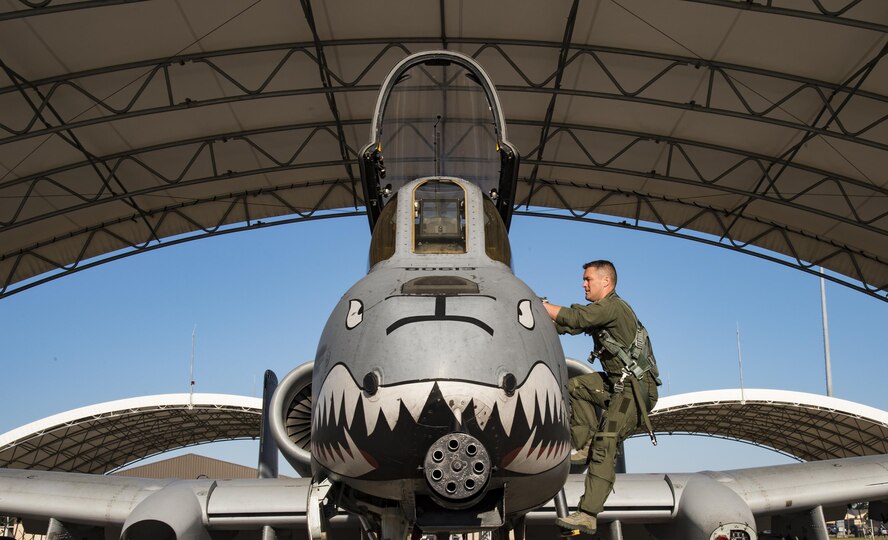 Lt. Col. Aaron “Marco” Redfern, 75th Fighter Squadron commander, climbs in an A-10C Thunderbolt II, April 25, 2017, at Moody Air Force Base, Ga. Redfern commanded the 75th FS for two years and led his pilots during the first A-10 combat deployment to Turkey in over a decade where they delivered more ordnance than any A-10 unit since Desert Storm. (U.S. Air Force photo by Andrea Jenkins) 