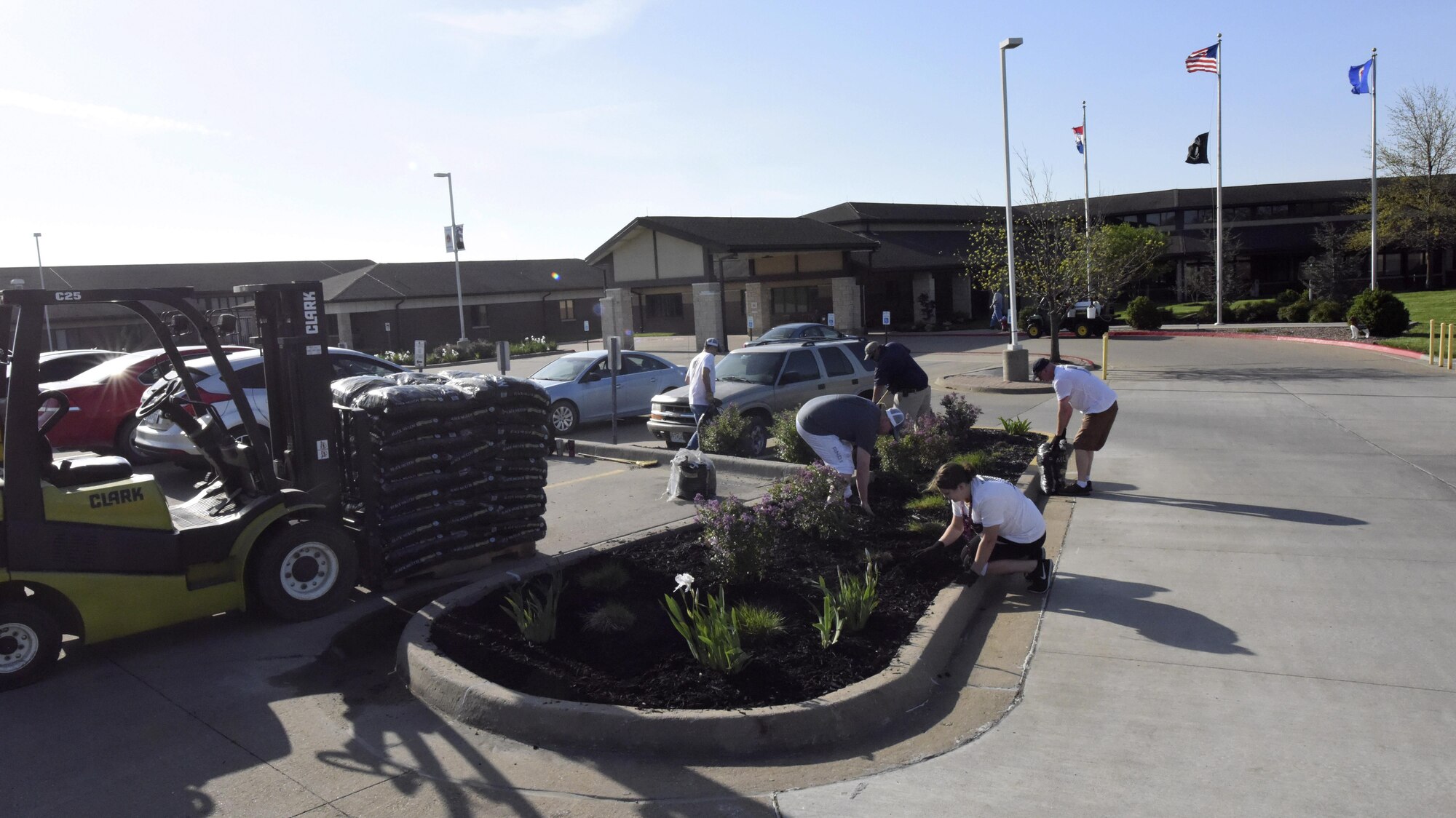 Operations Veterans Rising volunteers beautify the exterior of the Warrensburg Veterans Home, Mo., April 15, 2017. The Operation Veterans Rising is a non-profit organization created to help veterans and their families rise up from their daily struggles through a variety of financial aid programs.  (U.S. Air Force photo/ Senior Airman Danielle Quilla) 