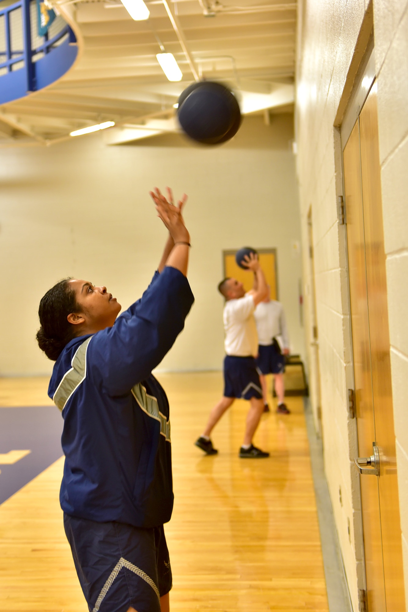 Members of the 22nd Medical Group participate in the wall ball event during the Beast Mode challenge May 10, 2017 at McConnell Air Force Base, Kan. Competitors had to throw a medicine ball above a fixed line and earn the most amount of repetitions. (U.S. Air Force photo/Staff Sgt. Trevor Rhynes)