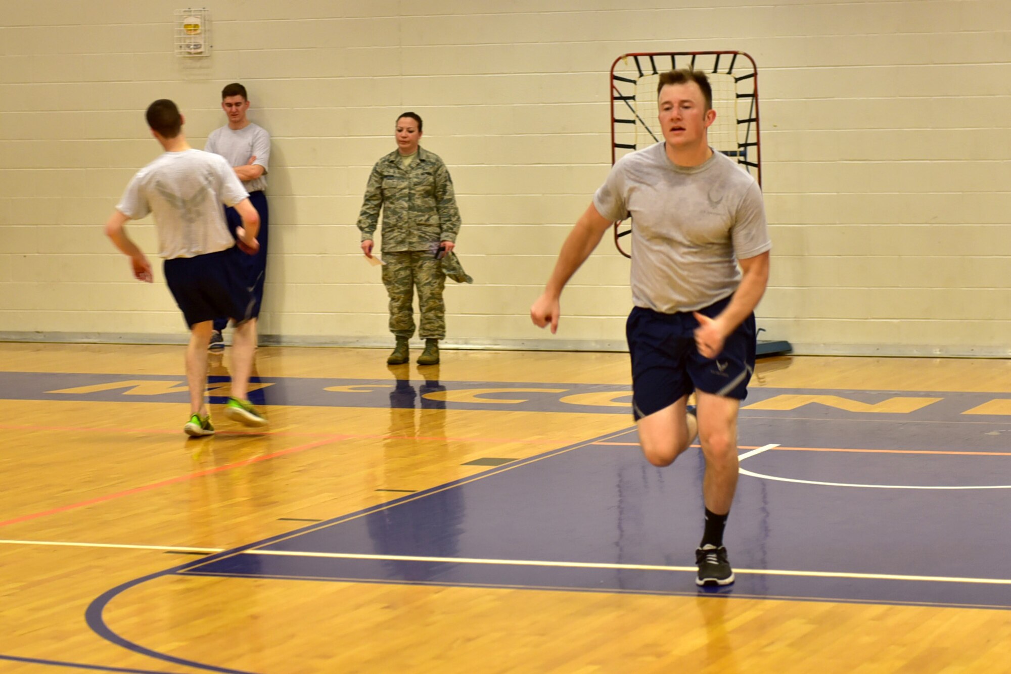 Members of the 22nd Medical Group sprint during the Beast Mode challenge May 10, 2017 at McConnell Air Force Base, Kan. Participants sprinted approximately 45 feet as many times as possible to add to their overall team score. (U.S. Air Force photo/Staff Sgt. Trevor Rhynes)