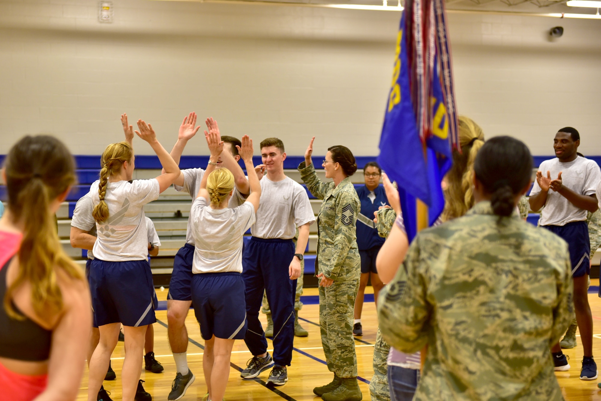 The 22nd Medical Operations Squadron celebrates their victory during the first Medical Group Beast Mode challenge, May 10, 2017, at McConnell Air Force Base, Kan. The challenge was comprised of six events, including push-ups, sit-ups and burpees, and the team with the highest amount of repetitions won. (U.S. Air Force photo/Staff Sgt. Trevor Rhynes) 