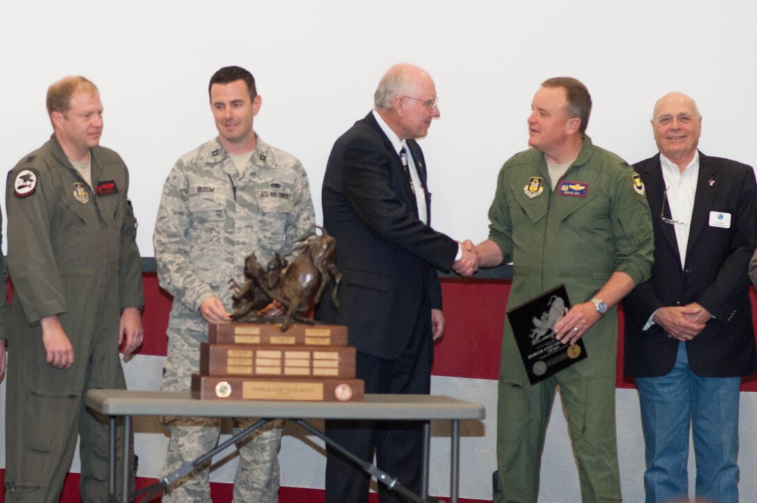 Colonel Bruce Cox accepts the Tenth Air Force Power and Vigilance Award from Mr. John Johnson of the Air Power Foundation. The Power and Vigilance Ward goes to the Tenth Air Force Unit that exhibits the Numbered Air Force's mission as "The premier provider of affordable, integrated, flexible, and mission-ready Citizen Airmen to execute power and vigilance in support of U.S. National Security."