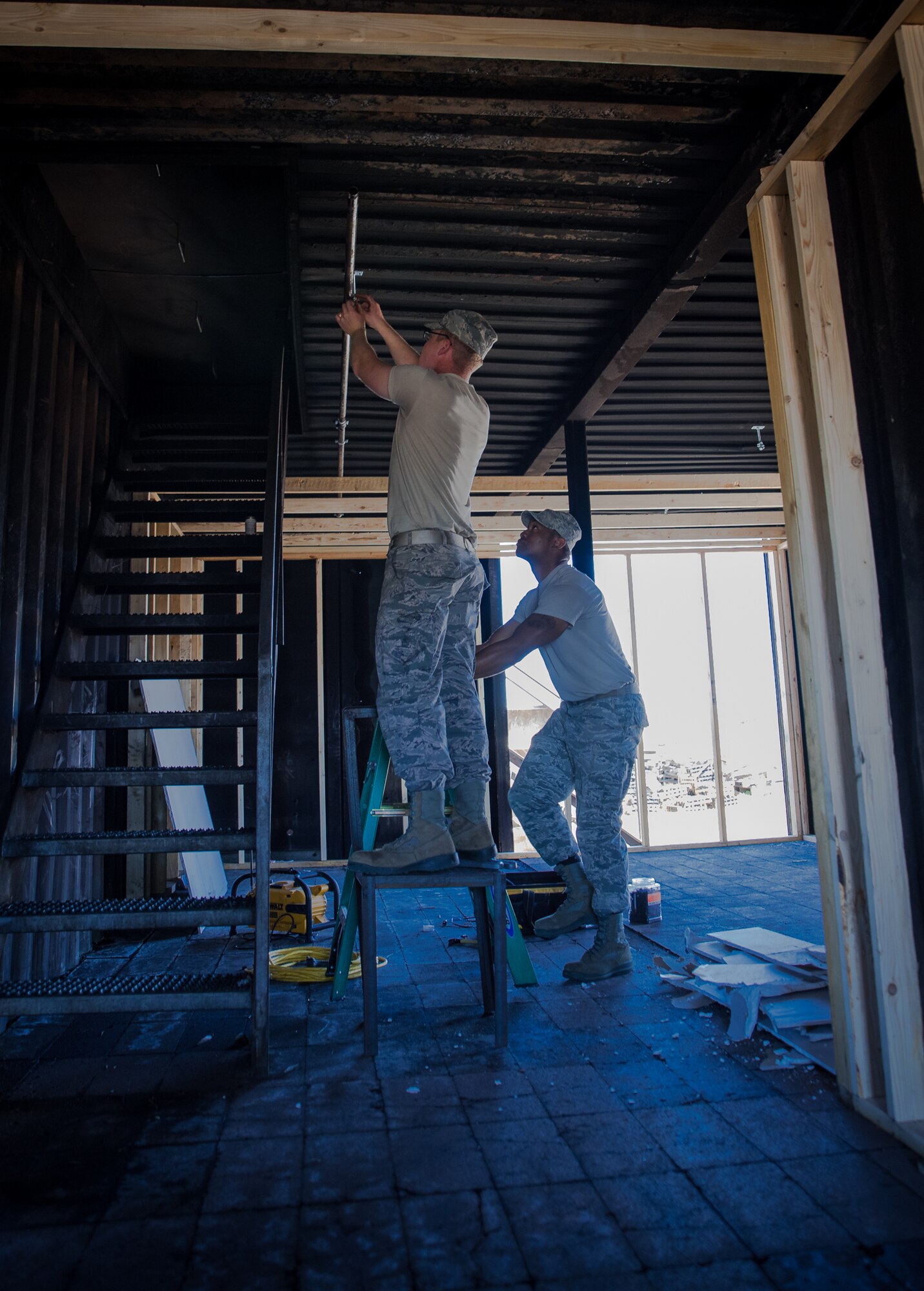 U.S. Air Force Airmen assigned to the 153rd Civil Engineer Squadron assist  Laramie County Fire District #2 with preparing their fire training structure for the upcoming Honoring Tradition, Leading Change Conference, May 6, 2017 in Cheyenne, Wyoming. The engineers were asked to install walls to create various rooms and add a fire suppression system within the district’s training structure. The project provided the water and fuels systems maintenance flight and the structural flight Airmen a chance to maintain their proficiency while helping the community. (U.S. Air National Guard photo by Tech. Sgt. John Galvin/Released)