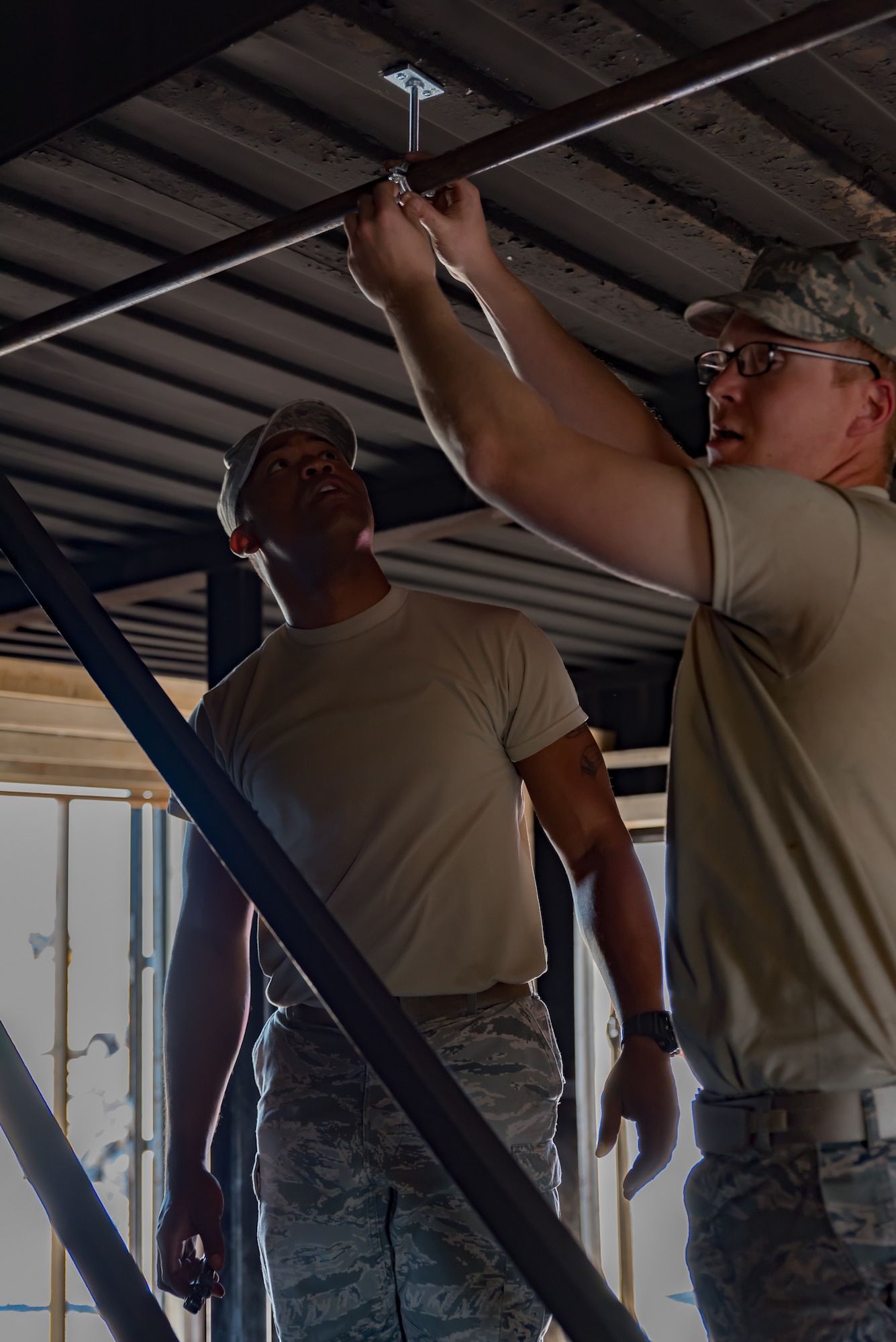 U.S. Air Force Airmen assigned to the 153rd Civil Engineer Squadron assist  Laramie County Fire District #2 with preparing their fire training structure for the upcoming Honoring Tradition, Leading Change Conference, May 6, 2017 in Cheyenne, Wyoming. The engineers were asked to install walls to create various rooms and add a fire suppression system within the district’s training structure. The project provided the water and fuels systems maintenance flight and the structural flight Airmen a chance to maintain their proficiency while helping the community. (U.S. Air National Guard photo by Tech. Sgt. John Galvin/Released)