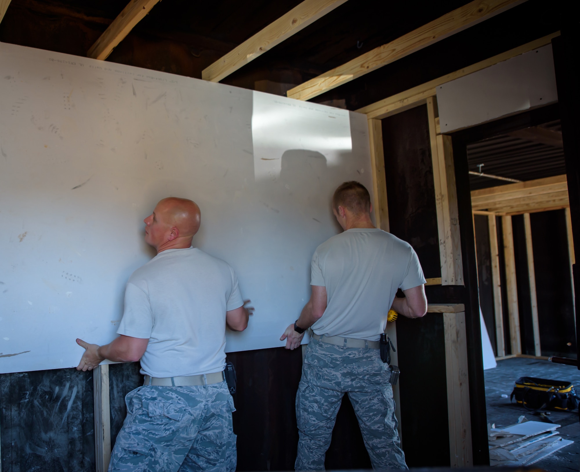 U.S. Air Force Airmen assigned to the 153rd Civil Engineer Squadron assist  Laramie County Fire District #2 with preparing their fire training structure for the upcoming Honoring Tradition, Leading Change Conference, May 6, 2017 in Cheyenne, Wyoming. The engineers were asked to install walls to create various rooms and add a fire suppression system within the district’s training structure. The project provided the water and fuels systems maintenance flight and the structural flight Airmen a chance to maintain their proficiency while helping the community. (U.S. Air National Guard photo by Tech. Sgt. John Galvin/Released)