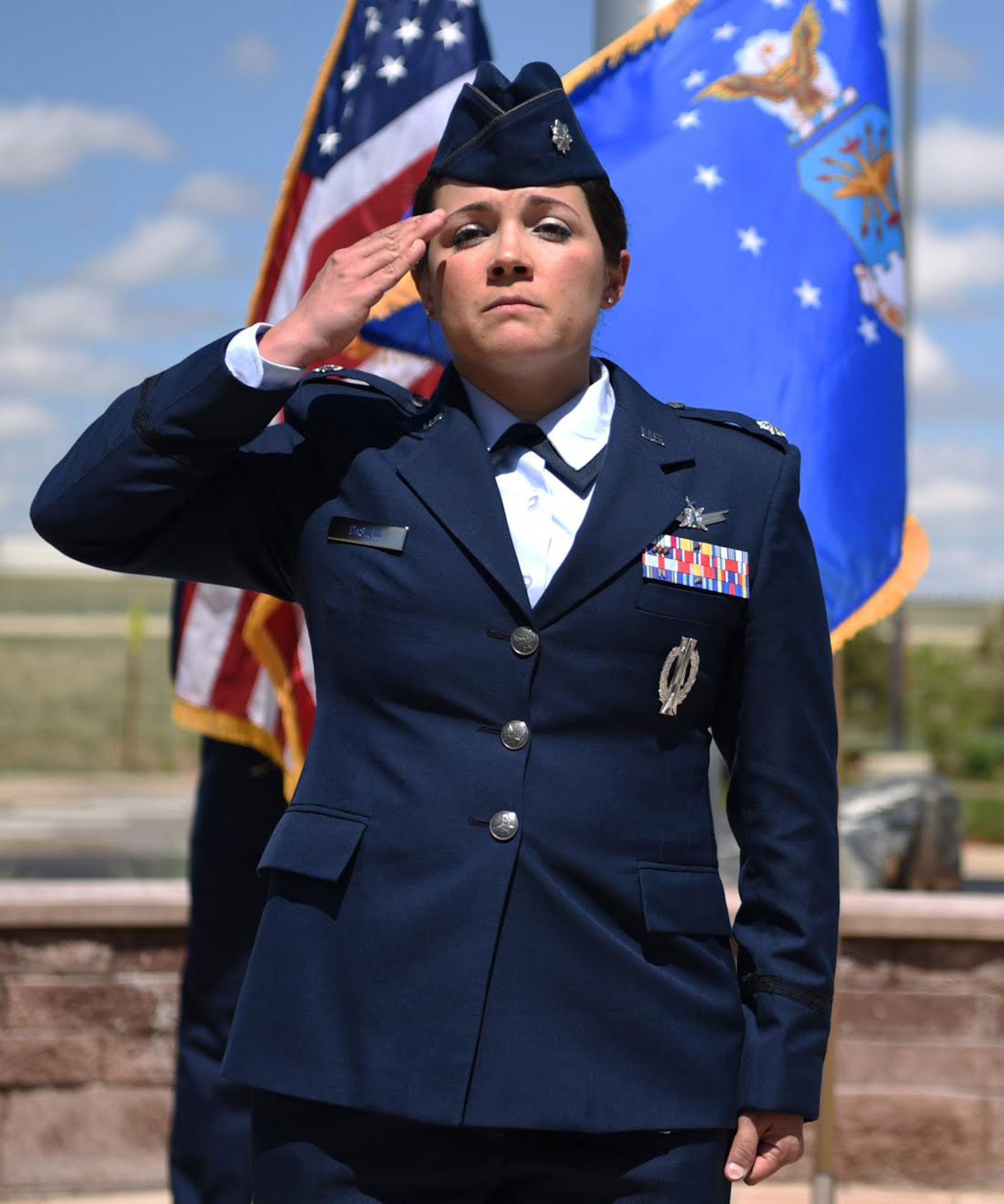 Lt. Col. Shannon DaSilva, 2nd Space Warning Squadron commander, renders the first salute to her new squadron May 11, 2017, on Buckley Air Force Base, Colo. Shannon is now responsible for the primary operations unit within the 460th OG, which continues to operate a more than 40-year-old, $3.2 billion on-orbit Defense Support Program satellite constellation. (U.S. Air Force photo by Airman 1st Class Holden S. Faul/Released)