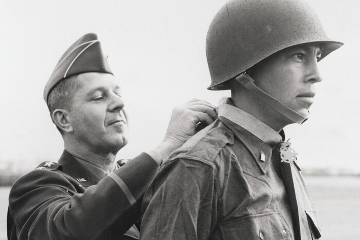 Army 2nd Lt. Ernest Childers, from the Muscogee Creek nation, receives the Medal of Honor at 5th Army headquarters in Italy, April 8, 1944. This photo is one of 24 panels displayed in the "Patriot Nations" exhibit on the second floor of the National Museum of the American Indian. Photo by Otto Bettmann, courtesy of the National Museum of the American Indian