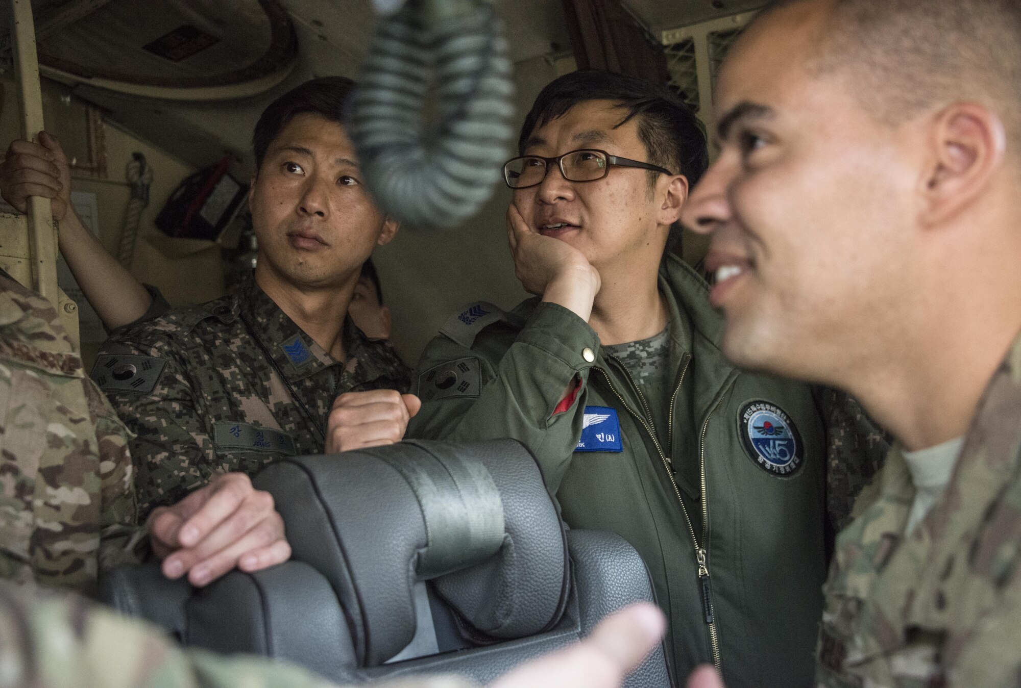 U.S. Air Force 353rd Special Operations Support Squadron radio frequency technicians engage with members of the Republic of Korea 255th Special Operations Squadron during a communications exchange on a ROK Air Force C-130, March 29, 2017 at Daegu Air Base, ROK. Foal Eagle 2017 provided the opportunity for targeted tactical exchanges focused on further developing interoperability with counterparts from the ROK military. (U.S. Air Force photo by Capt. Jessica Tait)