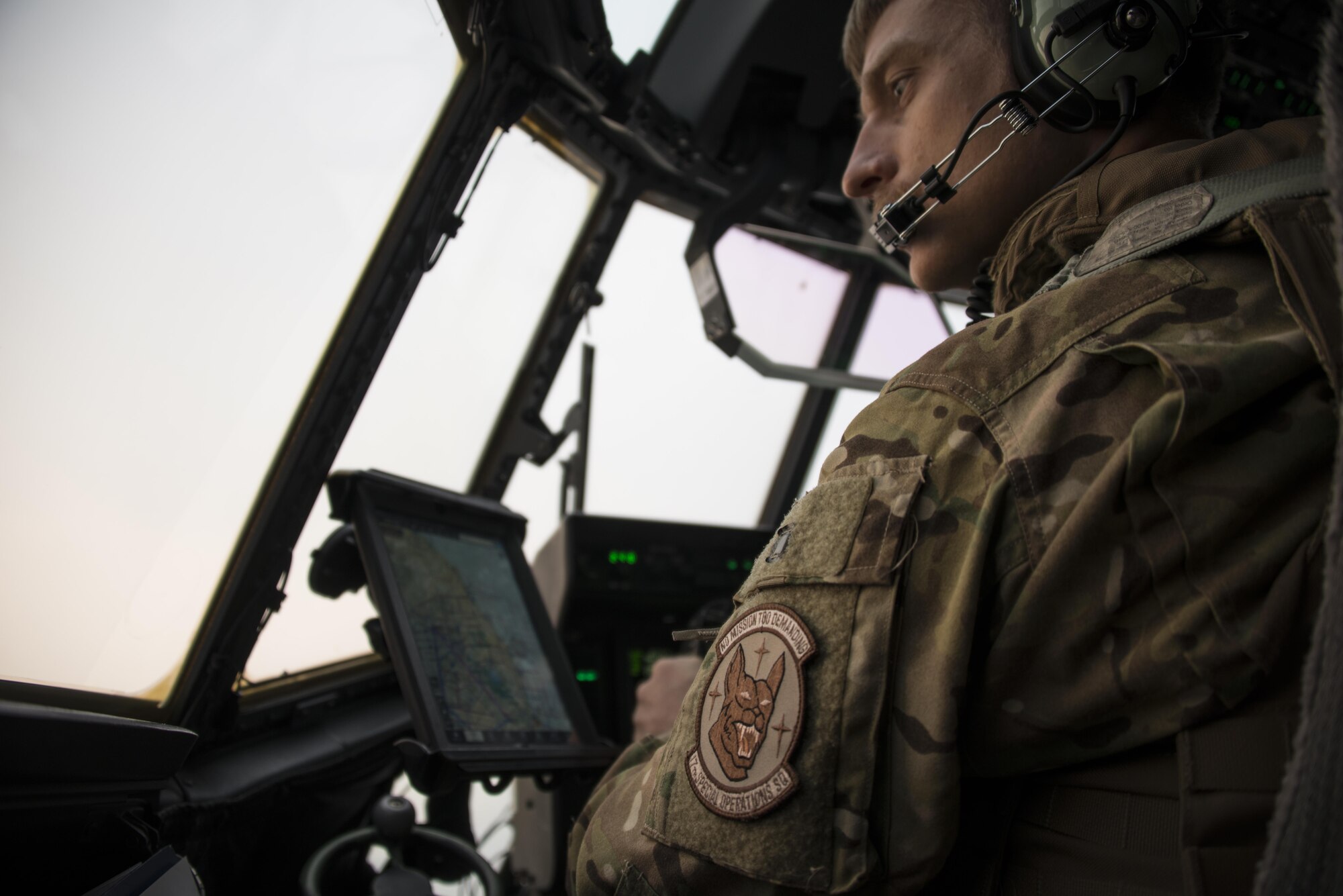 A U.S. Air Force 17th Special Operations Squadron pilot looks out the window of a U.S. Air Force MC-130J Commando II during combined airborne operations with Republic of Korea Special Warfare Command, March 27, 2017 over the ROK peninsula. Foal Eagle 2017 provided an opportunity for the 353rd Special Operations Group to advance interoperability and increase partner capacity by planning and executing complex training missions with joint and combined counterparts. (U.S. Air Force photo by Capt. Jessica Tait)